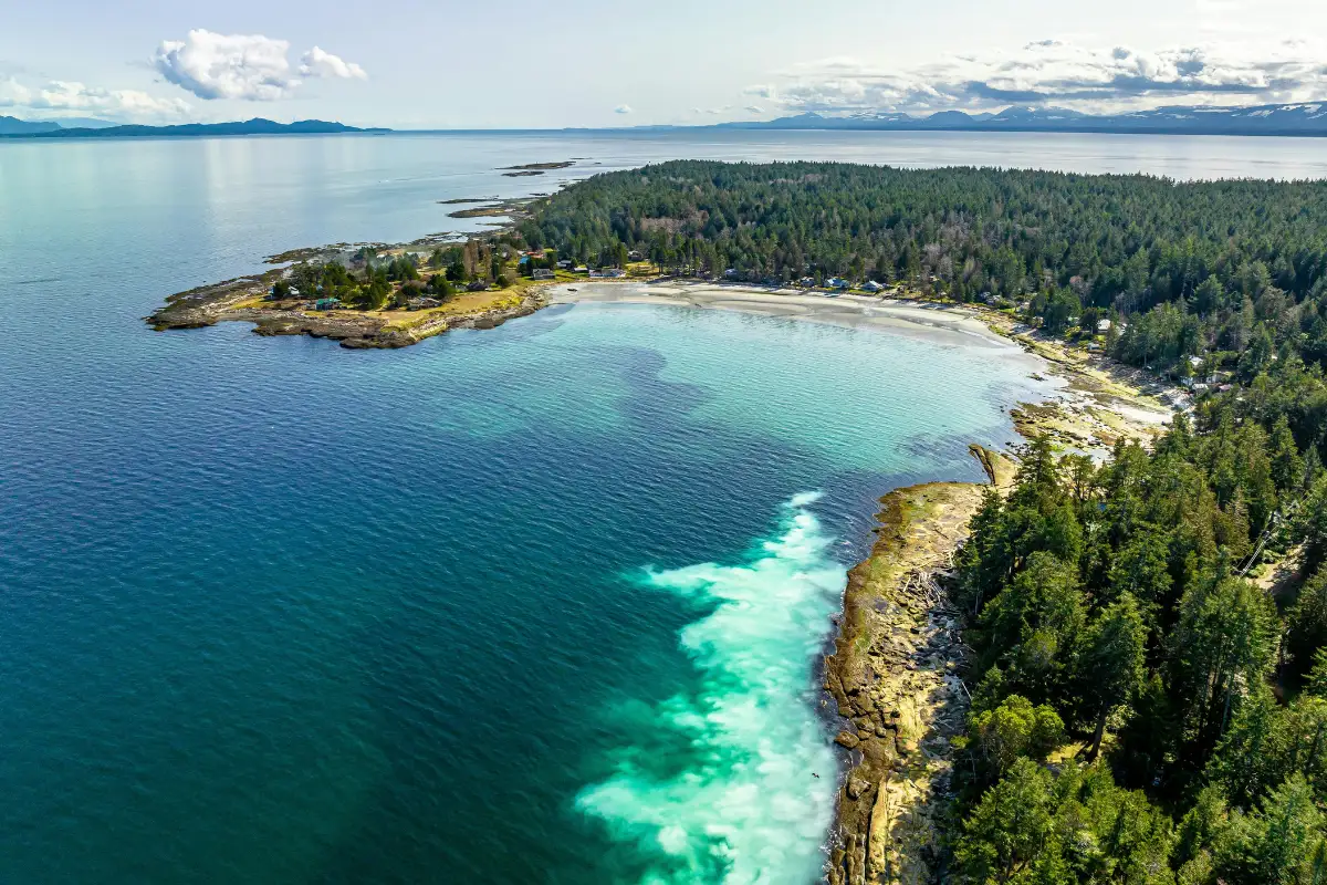 Hornby Island Tribune Bay coastline from the water — private yacht charter destination BC